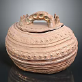 Carved Sculptural Pottery Jar With Lid Handles And Intricate Circular Patterns