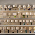 Various Designed Table Lamps Displayed On Multiple Shelves With Different Bases And Shades
