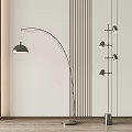Modern Arched Floor Lamp With Sleek Metal Design And Striped Wall Background