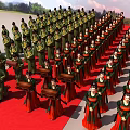 People In Traditional Green Red Costumes Marching Procession On Red Carpet With Blue Sky