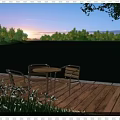 Scenic Lake View At Sunset With Wooden Deck Table Chairs And High Rise Buildings