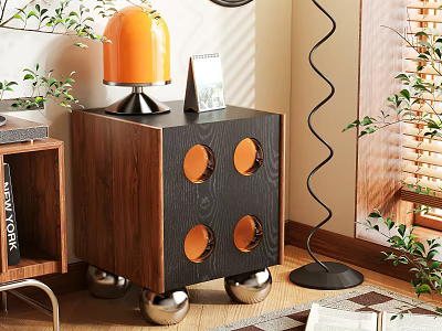 Wooden Nightstand With Black Panel Orange Lamp Photo Frame Circular Cutouts And Silver Spherical Legs 3d model