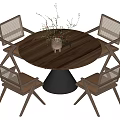 Round Wooden Dining Table With Four Woven Chairs Black Cone Base and Decor Plant Centerpiece