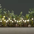 Decorative Lights Illuminating Lush Green Plants With Fresh Leaves And Natural Stones