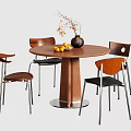 Modern Round Wooden Table And Chair Set With Metal Legs Vase Branches And Yellow Fruits