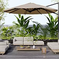 Cozy Outdoor Sofa Set on Wooden Deck with Patio Umbrella and Green Plants