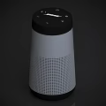 Bose Bluetooth Speaker With Cylindrical Design Silver Black Top Control Buttons And Mesh Surface