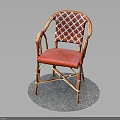 Red Wicker Chair With Patterned Backrest Curved Armrests And Metal Frame On Round Gray Mat