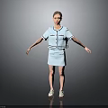 Woman In Light Blue Short Sleeve Top And Skirt With White Shoes On Gray Background