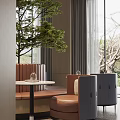 Sales Office Interior With Brown Padded Seating Round Table Dark Chairs Large Windows Trees Outside And Gray Curtains