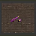 Rustic Wooden Table Displaying Pink Spinning Tops With Gold Accents