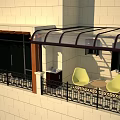 Stylish Patio Awning with Black Frame and Transparent Canopy on Building Terrace