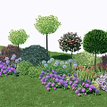 Colorful Garden Landscape With Various Flowers Bushes And Trees On Green Grass
