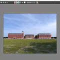 Traditional Red Brick School Building With Clock Tower Green Lawn And Large Windows