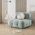 Puffy Green Plaid Single Sofa On Wooden Floor With Plant And Vase