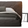 Comfortable Double Bed With Brown Upholstered Headboard White Pillows Green Blanket And Nightstand
