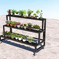 Black Multi tiered Flower Stand With Wheels Holding Various Potted Plants