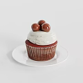 Delicious Red Cupcake With White Frosting And Chocolate Balls On White Plate