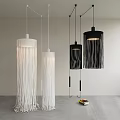 Stylish Modern Interior With Hanging White And Black Fringe Pendant Lights