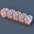 Fresh Sliced Ham Arranged on Gray Background Showing Pink And White Layers