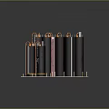 Black Cylindrical Structures With Orange Pipes On Top And Pink Base Supports