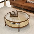 Round Coffee Table with Glass Top Brown Frame Woven Shelf Tray Water Bottle and Magazines