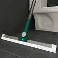 Household Cleaning Mop With Green Handle And White Mop Head On Tile Floor