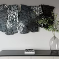 Modern Textured Black Silver Irregular Shape Wall Decor With Green Plant On Table 3d model
