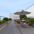 Stylish Roof Terrace With Wooden Deck Tables Chairs Umbrellas Green Plants And Ping Pong Table