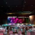 Elegant Banquet Hall Setup With Stage Large Screen Colorful Lights Round Tables And Chairs