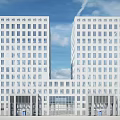 Modern White Office Building With Glass Facade And High Rise Design
