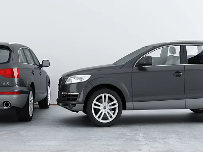 Two Gray SUVs With Front And Side Views Parked On Gray Floor Against White Background 3d model