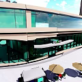 Grand Specialty Store Modern Glass Facade Building With Outdoor Tables Umbrellas And Chairs