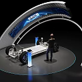 Car Chassis Display on Exhibition Stand with Person Observing and Blue Screen Background