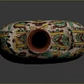 Sculptural Ceramic Vase With Colorful Carved Floral Motifs And Decorative Figure On Tripod Base