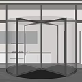 Modern Glass Revolving Door Interior with Sleek Metal Frame and Reflective Floor