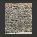 Rustic Stone Wall Structure With Mixed Colored Stones And Brick Top Layer