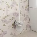 Modern Toilet Interior With Purple Floral Wallpaper And Wall Mounted Silver Rod White Holder