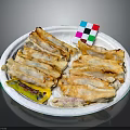 Crispy Fried Dumplings Served On White Plate With Yellow Sauce Packet And Colorful Small Card