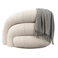 Plush Beige Single Sofa With Curved Design And Herringbone Throw Blanket