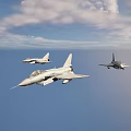 Three Military Fighter Jets Flying in Formation Against Clear Sky