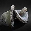 Curved Stone Sculpture Carving With Intricate Textured Surface And Abstract Design