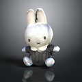 White Rabbit Toy With Gray Outfit And Bow Tie Sitting On Black Background