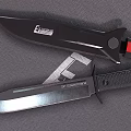 Two Tactical Knives Displayed On Textured Mat