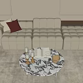 Modern Beige Sectional Sofa With Green Cushion And Round Marble Coffee Table On Light Rug