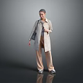 Woman Wearing Beige Trench Coat And Brown Pants On Gray Reflective Floor