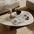 Oval Marble Coffee Table With Open Book Vase And Black Bowl On Wooden Floor