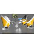 Stylish Table and Chair Set Featuring Yellow White Chairs Round Glass Table and Floral Centerpiece