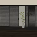 Modern Dark Sliding Doors With Louvered Design And Potted Plant In Interior
