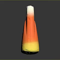 Stone And Wood Decorative Cone Shaped Object With Yellow Orange White Tones On Black Reflective Surface